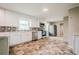 Modern kitchen featuring white cabinets, stainless steel appliances, and mosaic backsplash at 4935 Golden Sw Cir, Mableton, GA 30126