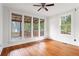Bright bedroom featuring hardwood floors, large windows, and white walls at 694 Peeples Sw St, Atlanta, GA 30310