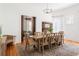 Bright dining room with hardwood floors, large table with seating, and a decorative chandelier at 694 Peeples Sw St, Atlanta, GA 30310