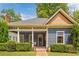 Detailed view of a home's facade, showcasing its intricate architectural elements and inviting front porch at 694 Peeples Sw St, Atlanta, GA 30310