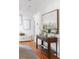 Hallway with wood floors, a console table, and art on the wall at 694 Peeples Sw St, Atlanta, GA 30310