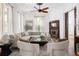 Bright living room with large windows, neutral furniture, and a decorative fireplace, creating a cozy atmosphere at 694 Peeples Sw St, Atlanta, GA 30310