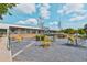 An outdoor patio seating area at the Food Hall offers a vibrant gathering spot with tables and landscaped planters at 694 Peeples Sw St, Atlanta, GA 30310