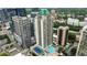Stunning aerial view of a high-rise building with pool and tennis court amenities at 1280 W Peachtree Nw St # 4003, Atlanta, GA 30309