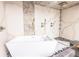 Spa tub with dual shower heads set against a marble tiled wall at 1280 W Peachtree Nw St # 4003, Atlanta, GA 30309
