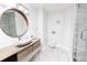Modern bathroom featuring marble floors, wood vanity, vessel sink and glass shower at 1280 W Peachtree Nw St # 4003, Atlanta, GA 30309