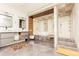 Large bathroom with double vanity, soaking tub and shower stall with gray tile at 1280 W Peachtree Nw St # 4003, Atlanta, GA 30309