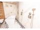 Modern tub with mosaic tile, mounted shower heads, and marble wall at 1280 W Peachtree Nw St # 4003, Atlanta, GA 30309