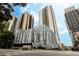Modern high-rise building featuring sleek design and an eye-catching tree graphic at 1280 W Peachtree Nw St # 4003, Atlanta, GA 30309