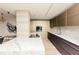 Modern kitchen featuring sleek appliances, marble countertops and backsplash, and a breakfast bar at 1280 W Peachtree Nw St # 4003, Atlanta, GA 30309