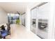 Bright living area featuring hardwood floors, access to the balcony, and city views at 1280 W Peachtree Nw St # 4003, Atlanta, GA 30309