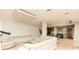 Bright living room featuring a modern design and view into kitchen, with light hardwood flooring at 1280 W Peachtree Nw St # 4003, Atlanta, GA 30309