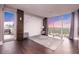 Bright living area featuring floor to ceiling windows and a plush rug on dark wood floors at 1280 W Peachtree Nw St # 4003, Atlanta, GA 30309