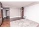 Bright room with hard wood floors, marble accent wall, plush rug and wood column accent at 1280 W Peachtree Nw St # 4003, Atlanta, GA 30309