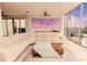 Spacious living area with floor-to-ceiling windows offering spectacular views of the city skyline at 1280 W Peachtree Nw St # 4003, Atlanta, GA 30309