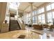 Stunning lobby with high ceilings, grand staircase, and elegant seating area at 1280 W Peachtree Nw St # 4003, Atlanta, GA 30309