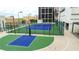 Community rooftop outdoor sports court features a basketball court and tennis court for recreation at 1280 W Peachtree Nw St # 4003, Atlanta, GA 30309