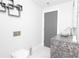 Sleek powder room with marble counter and a contemporary floating vessel sink at 1280 W Peachtree Nw St # 4003, Atlanta, GA 30309