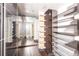 Large walk-in closet with custom shelving and mirrored doors at 1280 W Peachtree Nw St # 4003, Atlanta, GA 30309