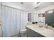 Bathroom featuring a vanity with a solid surface countertop and shower with curtain at 1463 Macklone Ne St, Atlanta, GA 30307