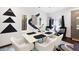 Modern dining room featuring a sleek table, white chairs, and artistic wall decor at 1463 Macklone Ne St, Atlanta, GA 30307