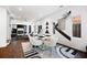 Bright dining area featuring modern white table and chairs with a modern chandelier and wall art at 1463 Macklone Ne St, Atlanta, GA 30307