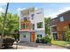 Modern home showcasing its clean lines, balconies, and an inviting orange-colored entrance at 1463 Macklone Ne St, Atlanta, GA 30307