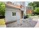 Driveway leading up to the home featuring a modern design and inviting orange front door at 1463 Macklone Ne St, Atlanta, GA 30307