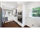 Modern kitchen featuring stainless steel appliances, white cabinets, and a stylish backsplash, perfect for culinary enthusiasts at 1463 Macklone Ne St, Atlanta, GA 30307