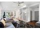Open-concept living area featuring modern decor, a stylish sofa, and dining area with natural light at 1463 Macklone Ne St, Atlanta, GA 30307