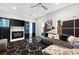 Comfortable living room with modern decor, fireplace, large gray sectional sofa, and geometric patterned rug at 1463 Macklone Ne St, Atlanta, GA 30307