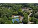 Aerial shot highlighting community pool, tennis courts, a gazebo and scenic lake surrounded by mature trees at 1781 Point Pleasant Se, Smyrna, GA 30080