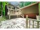 Backyard with large deck, stairs, and a view of the home's rear at 1781 Point Pleasant Se, Smyrna, GA 30080