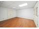 Finished basement with wood-look floors and access to the outdoors at 1781 Point Pleasant Se, Smyrna, GA 30080