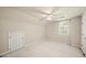 Bright bedroom with neutral color palette and an arched window at 1781 Point Pleasant Se, Smyrna, GA 30080