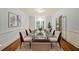 Elegant dining room featuring a large glass table and ample seating at 1781 Point Pleasant Se, Smyrna, GA 30080