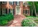 Inviting brick pathway and steps lead to the home's entrance, surrounded by lush landscaping at 1781 Point Pleasant Se, Smyrna, GA 30080