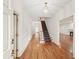 Welcoming foyer with hardwood floors, staircase, and elegant lighting at 1781 Point Pleasant Se, Smyrna, GA 30080