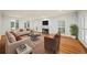 Spacious living room with fireplace, hardwood floors, and natural light at 1781 Point Pleasant Se, Smyrna, GA 30080