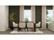 Bright dining area with seating for four, natural light, and minimalist decor at 2479 Cotton Ln, Douglasville, GA 30135