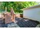 Landscaped backyard area featuring mulch and wooden stairs, offering a private outdoor space at 2879 Harlan Dr, Atlanta, GA 30344
