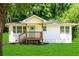 Charming home with fresh exterior paint, a welcoming porch, and well-maintained lawn at 2879 Harlan Dr, Atlanta, GA 30344