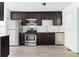 Kitchen features stainless steel appliances, dark cabinets and subway tile backsplash at 2879 Harlan Dr, Atlanta, GA 30344