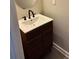 Modern bathroom vanity featuring a sink and a decorative wooden cabinet at 623 Shadowmoore Dr, Riverdale, GA 30274
