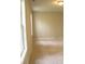 Bright bedroom with carpet, neutral walls, and windows for ample natural light at 623 Shadowmoore Dr, Riverdale, GA 30274
