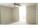 Neutral bedroom featuring carpet flooring, ceiling fan, and natural lighting from windows at 623 Shadowmoore Dr, Riverdale, GA 30274