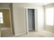 Bright bedroom with carpet flooring, and a view into a closet space at 623 Shadowmoore Dr, Riverdale, GA 30274
