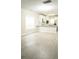 Bright living space connected to kitchen, featuring modern flooring and ample natural light at 623 Shadowmoore Dr, Riverdale, GA 30274