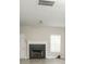 Cozy living room featuring a fireplace and large windows, with ample natural light at 623 Shadowmoore Dr, Riverdale, GA 30274