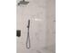 Stylish walk-in shower with modern fixtures, a shower bench, and beautiful marble-look tiles at 623 Shadowmoore Dr, Riverdale, GA 30274